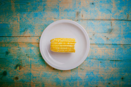 Boiled sweet corn on white plate