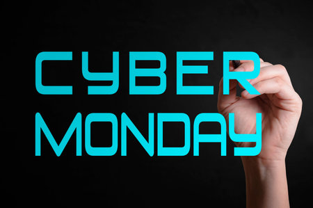 Hand writing Cyber Monday with marker on transparent wipe board.の写真素材