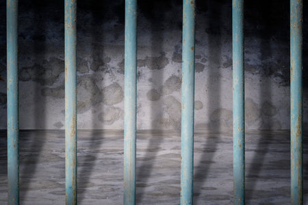 Jail cells iron bars casting shadows on the prison floor