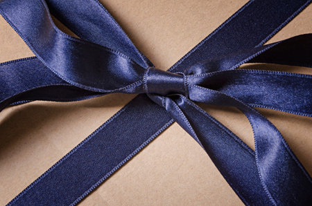 Vintage gift box with blue ribbon bow detail, top viewの写真素材