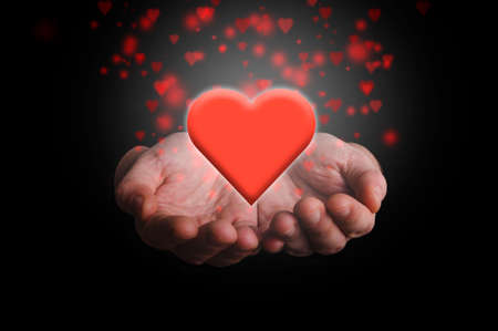 Hands giving red heart. Love concept.の写真素材