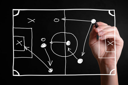 Hand drawing a football strategy plan drawn on a virtual screen