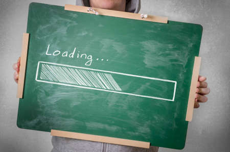 Loading progress bar on chalkboardの写真素材