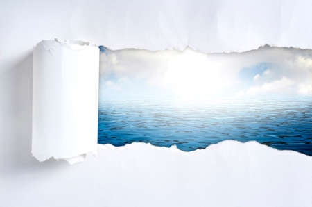 Torn paper with nature in opening backgroundの写真素材