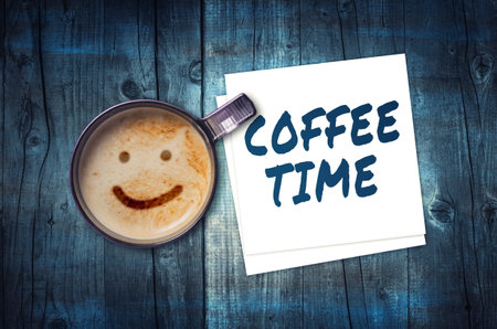 Cup of coffee and coffee time noteの写真素材