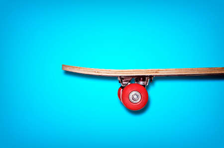 View of the skateboard on a blue backgroundの写真素材