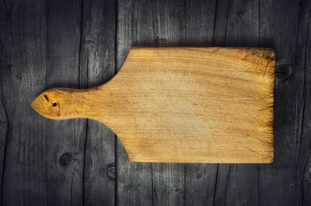 Empty vintage cutting board on planks food background conceptの写真素材