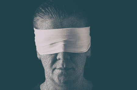 Blindfolded woman close up patterned with no-sense words. Concept of censorship, freedom of speech, freedom of press.の写真素材