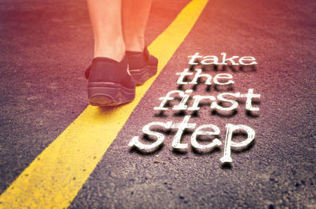 Take the first step inspirational concept on the roadの写真素材