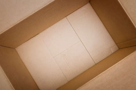 Empty cardboard box- selective focus on the bottom of the boxの写真素材