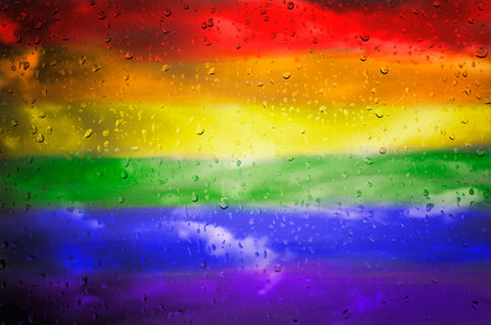 Drops of water on rainbow flag background.の写真素材