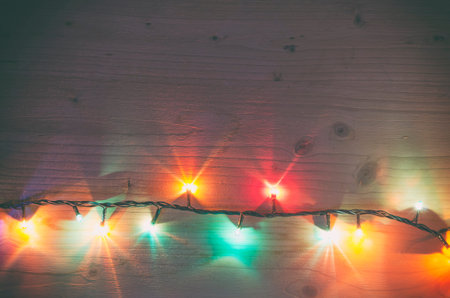 Christmas rustic background - vintage planked wood with lights and free text spaceの写真素材