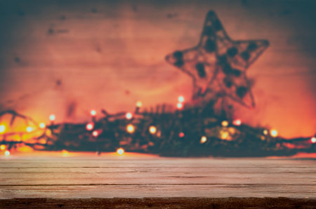 Christmas lights on empty table. Selective focus. の写真素材