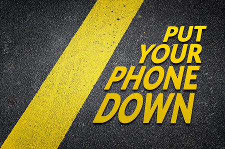 Put your phone down road sign conceptの写真素材