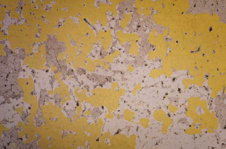 Peeling yellow paint wall texture for backgroundの写真素材