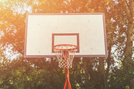 Outdoor basktetball hoop in a park. Basketball background.の写真素材