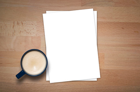 Blank letterhead and coffee cup on wooden table background. Blank branding template. Mockup for...