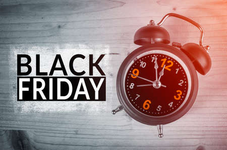 Black Friday text with old analog clock. Black Friday sale concept.の写真素材