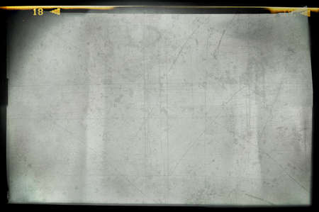 Blank grained and scratched film strip texture backgroundの写真素材