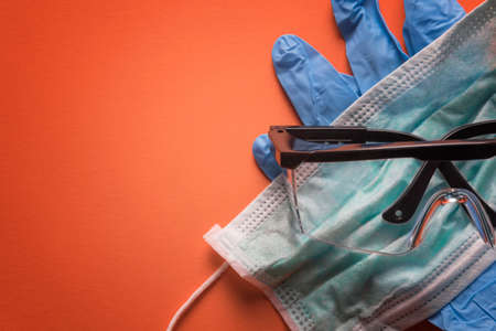 Gloves, mask, and safety glasses. Health care and medical background concept.の写真素材