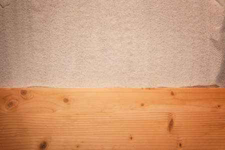 Beach background. Top view of beach sand on old wood plank. Summer vacation concept.の写真素材