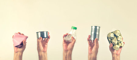 Hands holding and show recycle materials. Reuse and Recycle for World environment concept.の写真素材