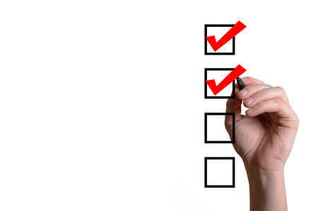 Blank checklist on the whiteboard with businessman hand drawing a red check mark in the check box