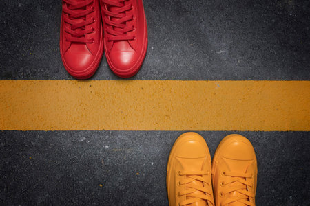 Social distancing concept - to avoid spreading of virus. Two people standing opposite each other...