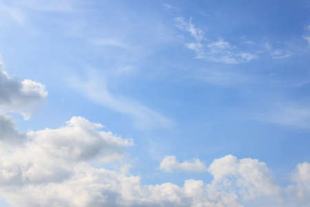 Clear blue sky with white cloudの写真素材