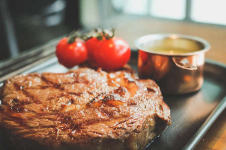 Close up of beefsteak on the tray in the restaurant.の写真素材