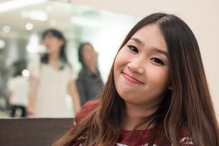 Close up of pretty Asian girl in the departent storeの写真素材