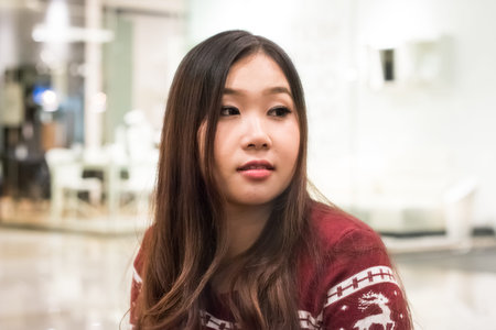 Close up of pretty Asian girl in the departent store