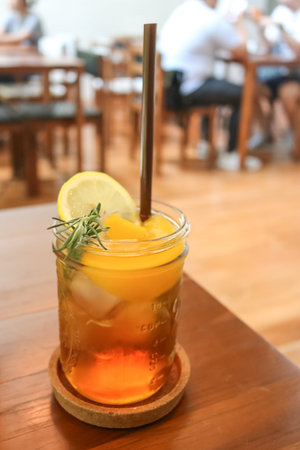 Glass of Peach tea in the cafeの写真素材