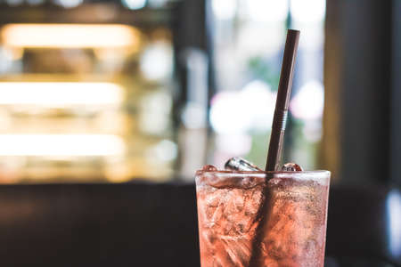 Glass of iced berry soda with blur backgroundの写真素材