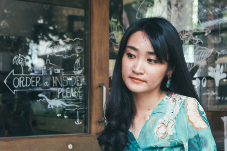 Beautiful Asian woman smiling in outdoor scene.の写真素材