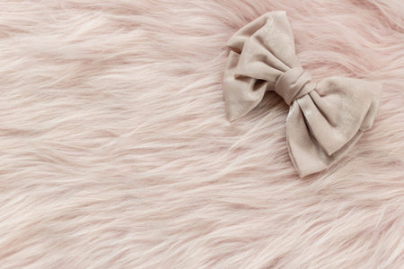 Luxury hair clip on pink fabric with copyspace.