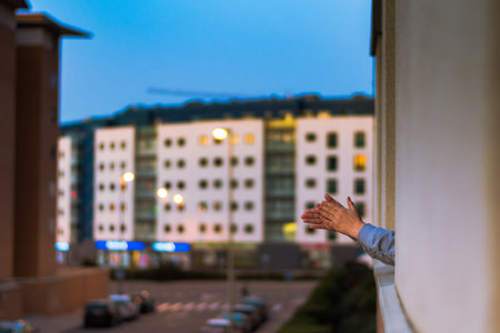 Doctor with mask and goggles wearing blue latex gloves. White background.の写真素材