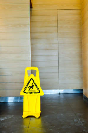 Caution wet floor sign in a new corporate building の写真素材
