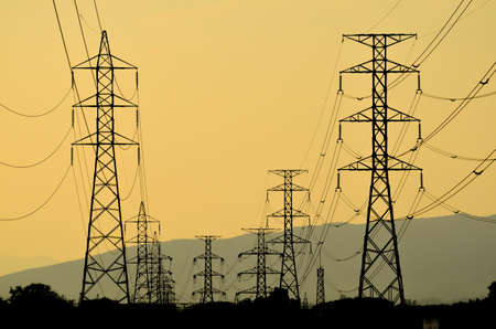 High voltage power pylons at sunset, Thailandの写真素材