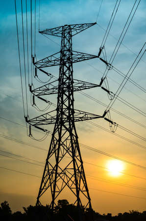 High voltage power pylons at sunset, Thailandの写真素材