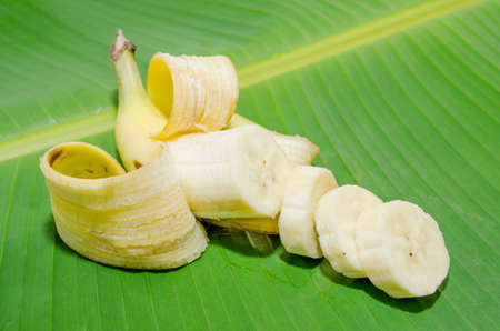 Sliced pieces of banana shell casing on a banana leaf の写真素材
