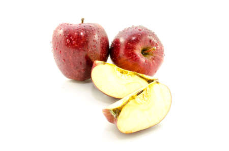 Fresh red apple with water droplets and leaf, isolated on white background の写真素材