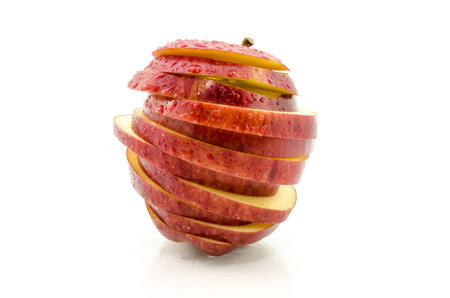 Fresh red apple with water droplets and leaf, isolated on white background の写真素材