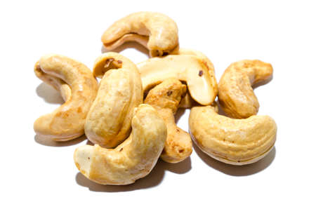 Pile of roasted cashew nuts in isolated white backgroundの写真素材