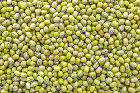 Whole dried mung beans. This type of bean is often sprouted to make bean sprouts.の写真素材