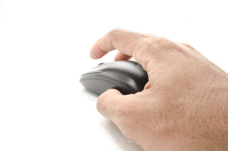 young man hand and wireless computer mouse isolated on white background.の写真素材