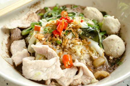 bowl of pungent thai pork noodle soupの写真素材