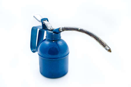 isolated old dark blue metal oil canの写真素材