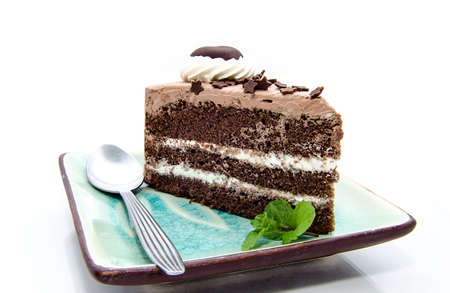 A heart shaped piece of chocolate isolated on whiteの写真素材