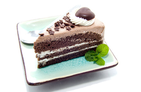 A heart shaped piece of chocolate isolated on whiteの写真素材